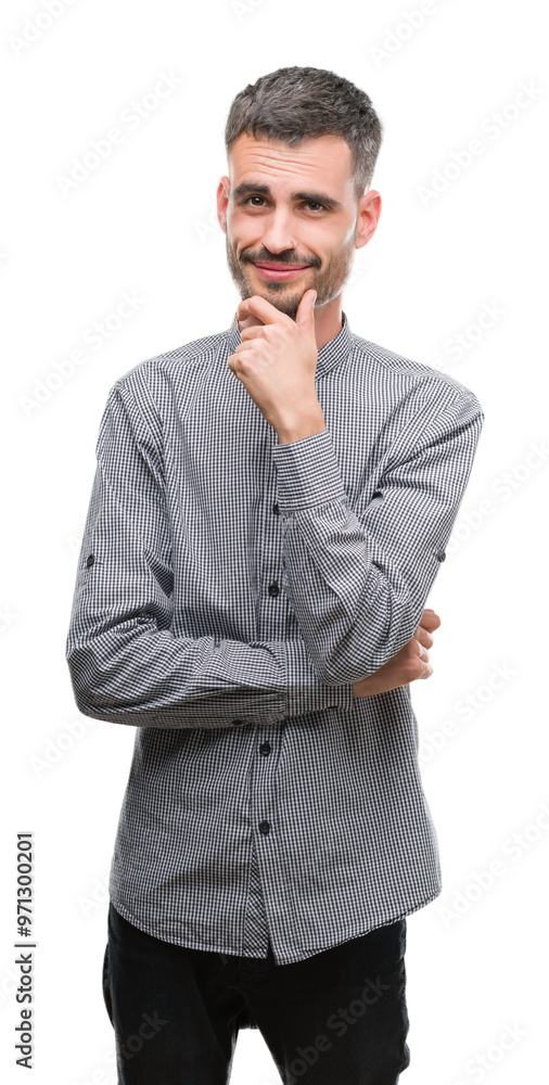 Young hipster man looking confident at the camera with smile with crossed arms and hand raised on chin. Thinking positive. Young hipster man looking confident at the camera with smile with crossed arms and hand raised on chin. Thinking positive.
