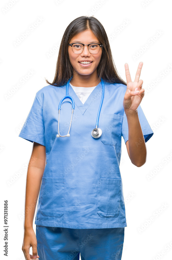 Young asian doctor woman over isolated background smiling with happy face winking at the camera doing victory sign. Number two. Young asian doctor woman over isolated background smiling with happy face winking at the camera doing victory sign. Number two.