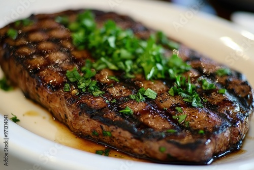 a piece of steak on a white plate