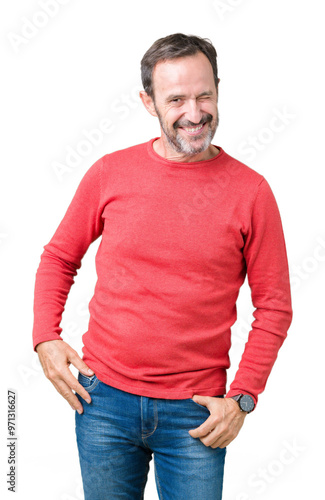 Handsome middle age hoary senior man wearing winter sweater over isolated background winking looking at the camera with sexy expression, cheerful and happy face.