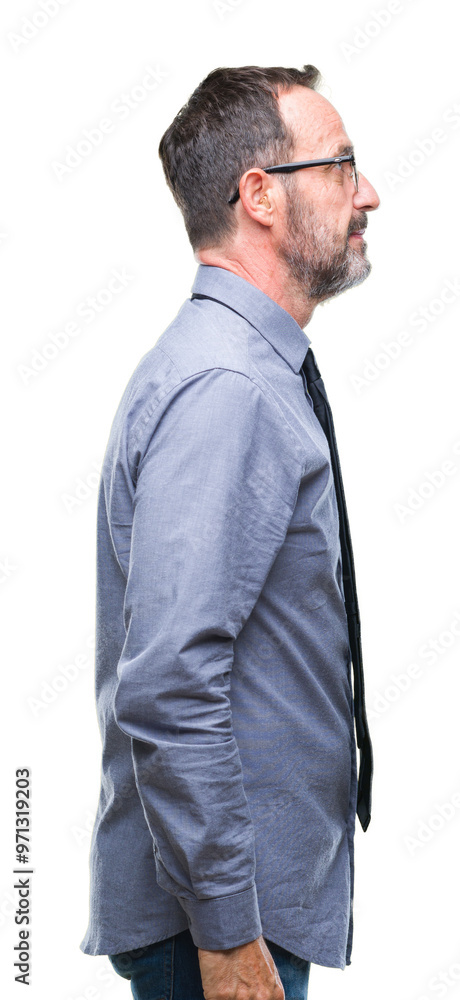 Middle age hoary senior business man wearing glasses over isolated background looking to side, relax profile pose with natural face with confident smile. Middle age hoary senior business man wearing glasses over isolated background looking to side, relax profile pose with natural face with confident smile.