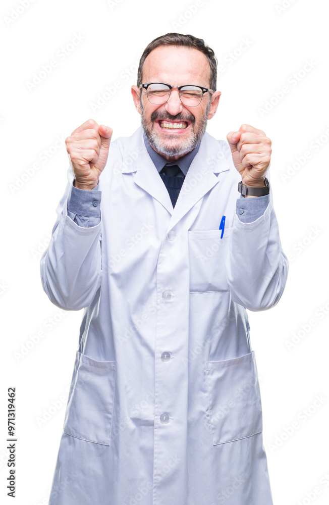 Middle age senior hoary professional man wearing white coat over isolated background excited for success with arms raised celebrating victory smiling. Winner concept. Middle age senior hoary professional man wearing white coat over isolated background excited for success with arms raised celebrating victory smiling. Winner concept.