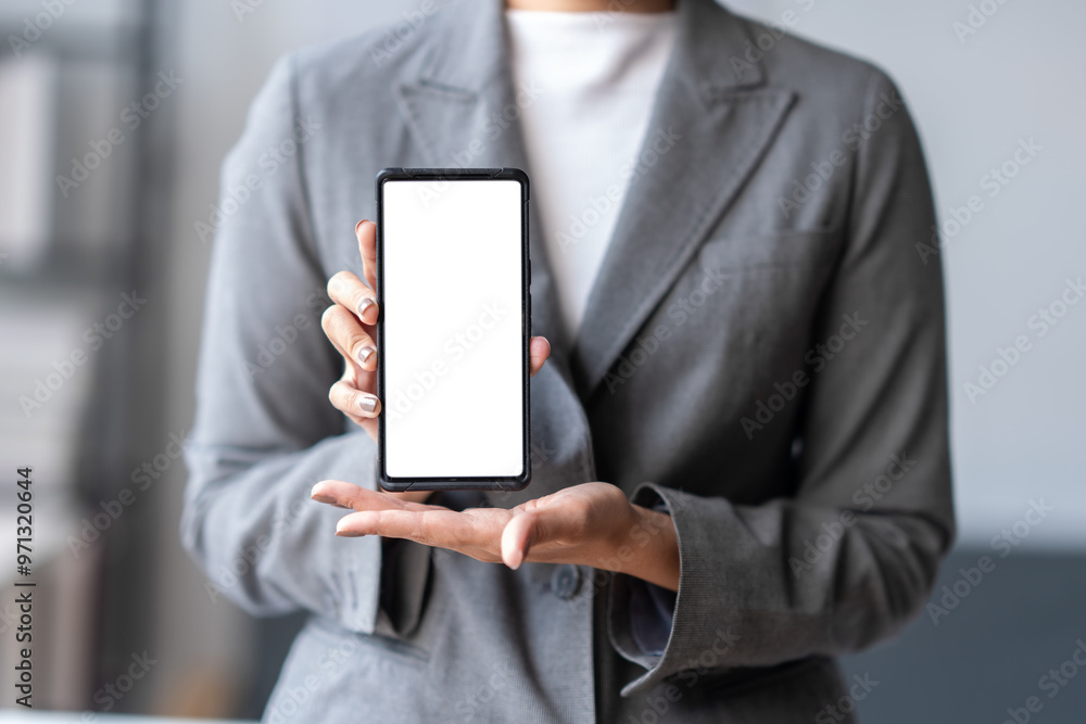 Businesswoman holding smartphone with blank screen for mockup Businesswoman holding smartphone with blank screen for mockup