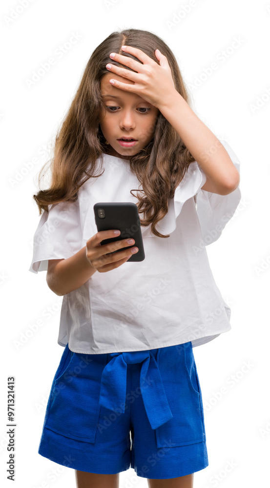 Brunette hispanic girl using smartphone stressed with hand on head, shocked with shame and surprise face, angry and frustrated. Fear and upset for mistake. Brunette hispanic girl using smartphone stressed with hand on head, shocked with shame and surprise face, angry and frustrated. Fear and upset for mistake.