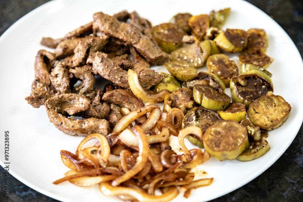 Traditional, strong and nutritious real food, liver with okra and onion Traditional, strong and nutritious real food, liver with okra and onion