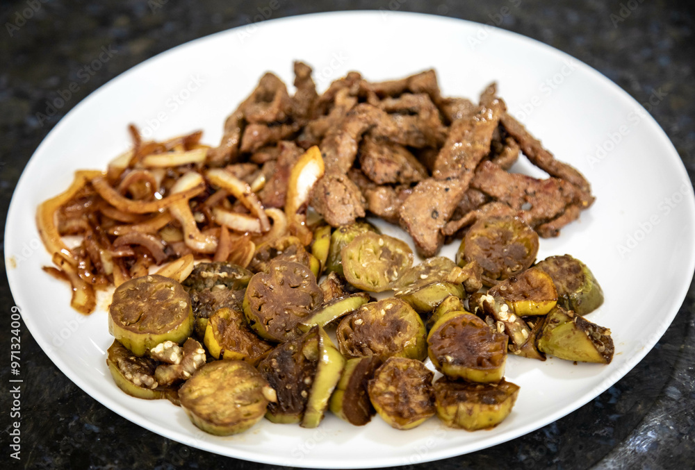 Traditional, strong and nutritious real food, liver with okra and onion Traditional, strong and nutritious real food, liver with okra and onion