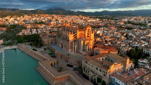 orbiting aerial view of cathedral of Palma de Mallorca, Palma de Mallorca cityscape. Cathedral of Santa Maria, Royal Palace of La Almudaina. Balearic Islands. Spain
