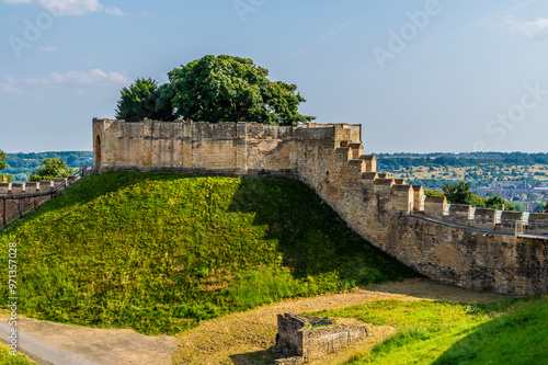 A view across the Castle courtyard towards the Lucy Tower in Lincoln, Lincolnshire in summertime photo