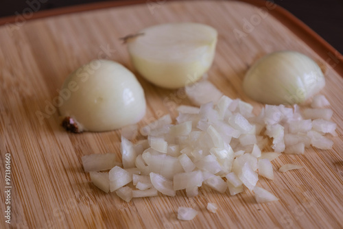 Chopped Onion on Wooden Board Close-Up on Dark Background