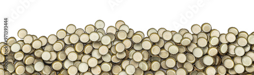 a pile of crown caps from beer bottles in front of a white background as a panorama, border or banner
