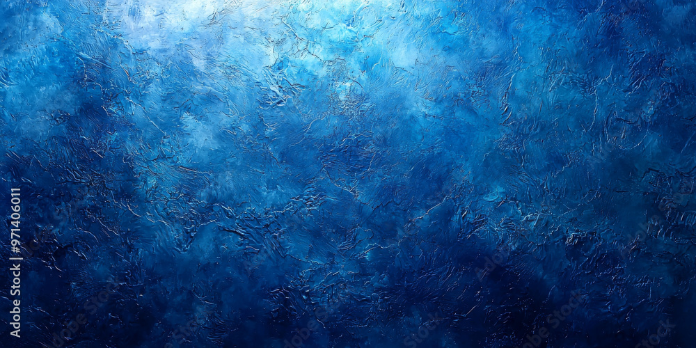 Obraz premium Textured blue background with a light source on the top.