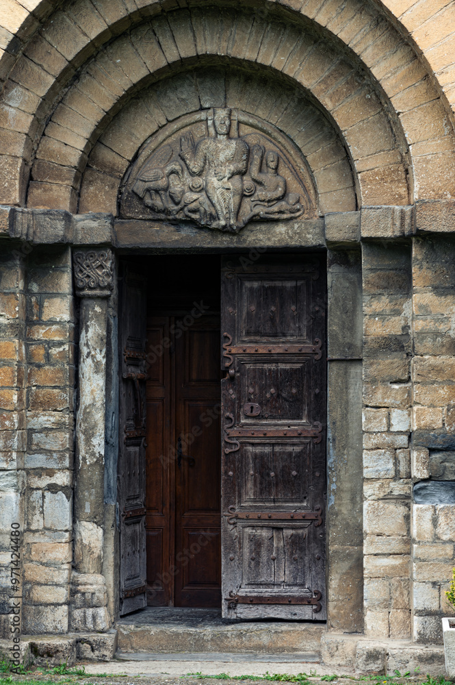 Fototapeta premium entrance door to the church of Sant Feliu de Vilac, Vielha, Lleida