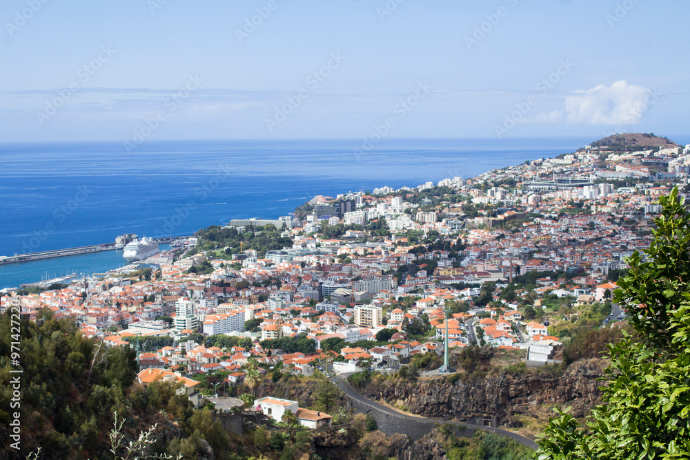 Beautiful view of the city on a summer day. Top view. Funchal. Madeira. Portugal. Beautiful view of the city on a summer day. Top view. Funchal. Madeira. Portugal.