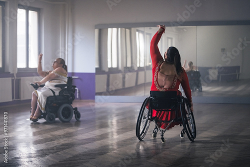 Photos Para dance sport, two determined women with disability enjoy practicing elegant and stylish movements on wheelchair