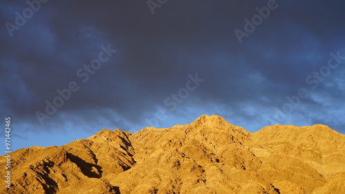 Photography cloudy sunset makes the mountain glowing gold in east Las Vegas