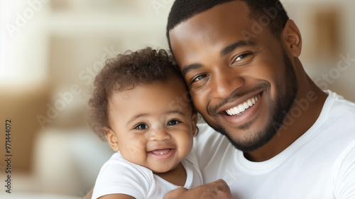 A stunning, highly detailed family portrait of an African American father, age 30, with his adorable baby, both smiling under soft, warm lighting, the photo framed in gentle, brigh