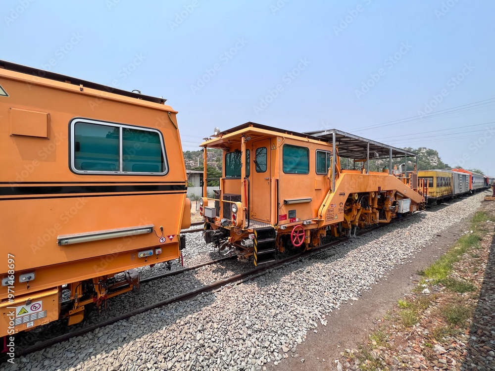 The ballast tamping machines are parked in the site. The ballast tamping machines are parked in the site.