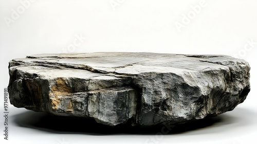 A flat, round stone slab with textured surfaces, resembling a natural table or display piece.