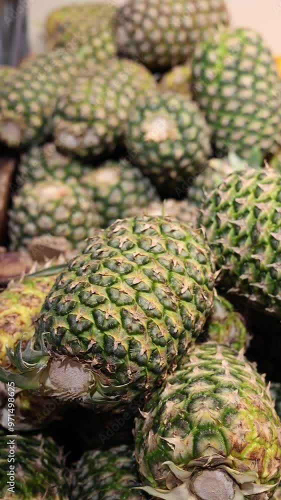 pineapples lie in a pile vertical video pineapples lie in a pile vertical video