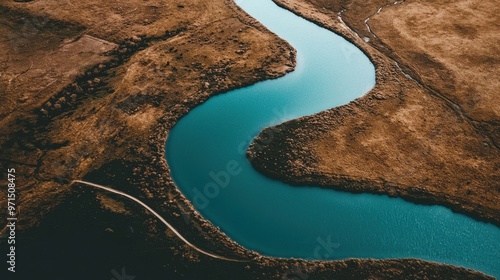 A flowing river that starts small and expands into a wide delta, representing the scalable nature of ideas, systems, and processes as they grow and reach broader horizons photo