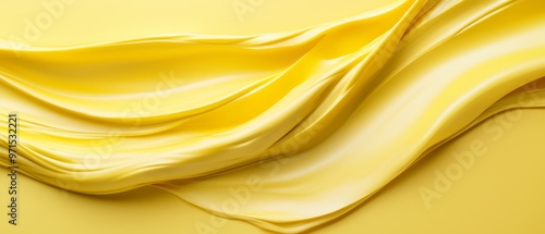  A tight shot of a yellow fabric against a uniform yellow backdrop, showcasing the unwrinkled, fluid texture in the picture's heart photo