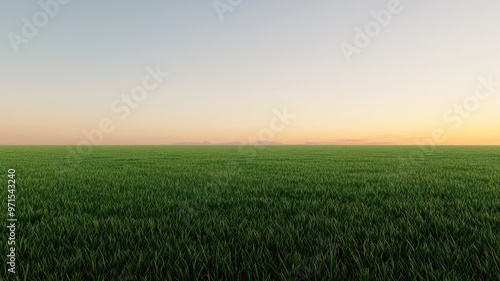 A serene landscape featuring a lush green field under a peaceful sky during sunrise, perfect for nature-themed projects.