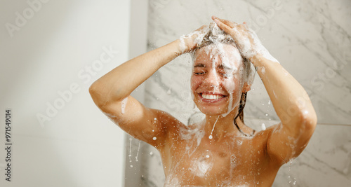 Canvas Print A joyful woman playfully enjoying a moment in the shower, shampoo in her hair, r