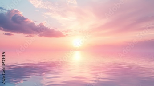 Pink sunset reflecting in calm ocean water with clouds