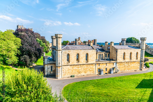 A view down the side of  Lincoln Castle past the Lincoln Crown Court in Lincoln, Lincolnshire in summertime photo