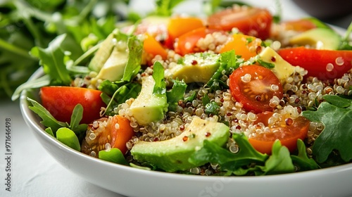  A crisp salad featuring vibrant tomatoes, creamy avocado, fresh lettuce, and assorted vegetables artfully arranged in a pristine white bowl