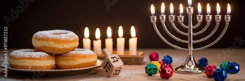 Festive Hanukkah Setting with Doughnuts, Dreidels, and Lit Menorah photo