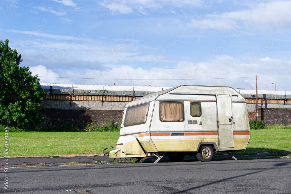 Caravan abandoned and dumped in street waiting to be removed Caravan abandoned and dumped in street waiting to be removed