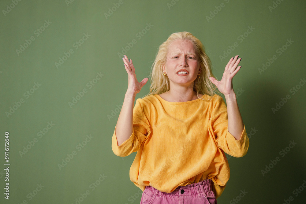 Stressed Young Woman on Green Background Stressed Young Woman on Green Background