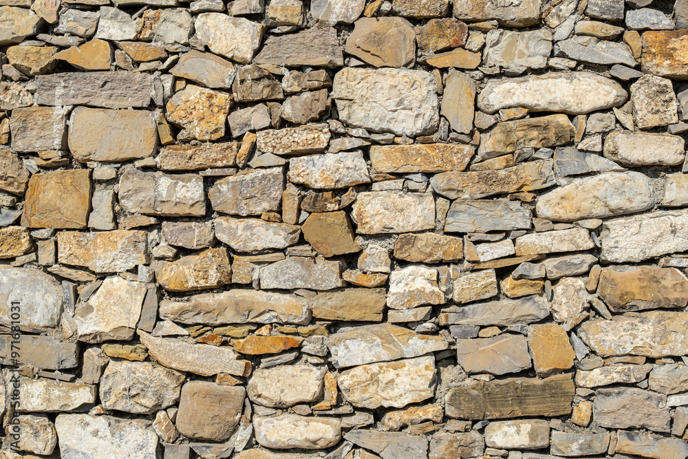 stone wall made of limestone, typical of ancient cities. The craftsmanship of stonemasons is evident in the construction. stone wall made of limestone, typical of ancient cities. The craftsmanship of stonemasons is evident in the construction.