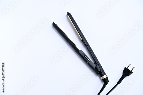 Wallpaper Mural Styler for straightening and curling hair on a white background close-up Torontodigital.ca