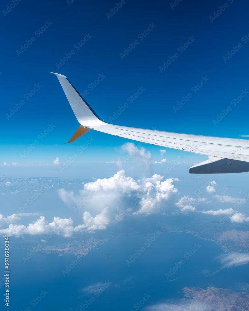 airplane window view with clouds and airplane wing airplane window view with clouds and airplane wing