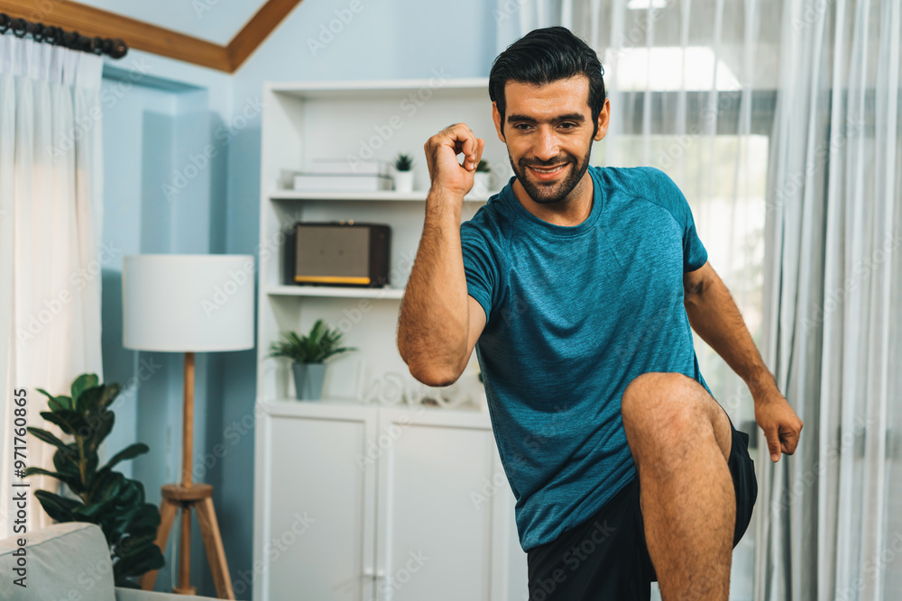Athletic and sporty man running posture at home body workout exercise session for fit physique and healthy sport lifestyle at home. Gaiety home exercise workout training. Athletic and sporty man running posture at home body workout exercise session for fit physique and healthy sport lifestyle at home. Gaiety home exercise workout training.