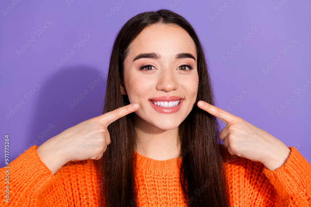 Photo of lovely cute cheerful girl wear stylish orange clothes demonstrate white teeth isolated on purple color background Photo of lovely cute cheerful girl wear stylish orange clothes demonstrate white teeth isolated on purple color background