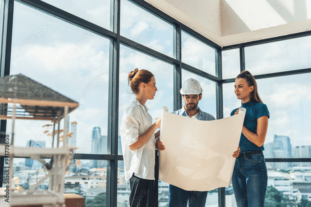 Fototapeta premium Group of architect engineer looking at project plan while brainstorming idea about building structure. Manager team discuss about building construction while standing near with city view. Tracery.