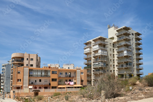 Eerie Landscapes of Spain's Housing Bust: Incomplete Developments and Desolate Neighborhoods Under Vast Skies. Remnants of Spain's Economic Downturn: Unoccupied Homes and Barren Skylines in