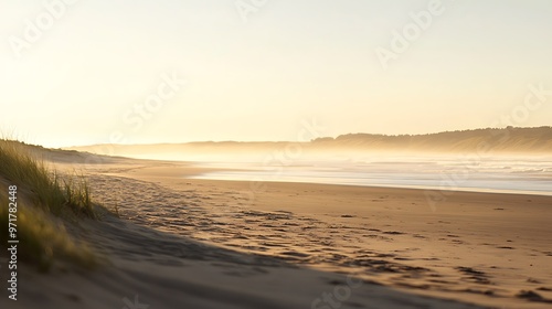 A soft, blurred beach at sunset with a clear sky for text 