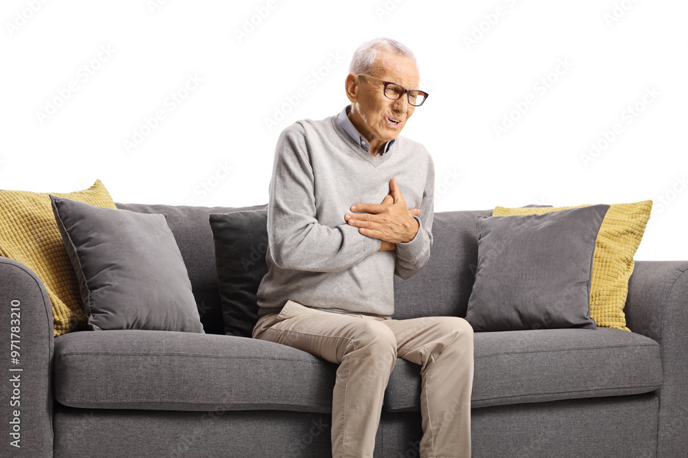 Elderly man with sudden cardiac arrest sitting on a sofa Elderly man with sudden cardiac arrest sitting on a sofa