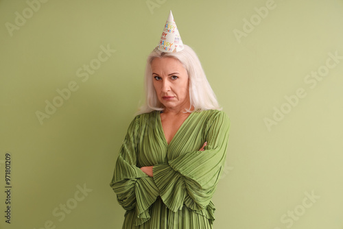 Upset mature woman in party...