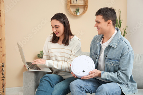 Young couple with modern ro...