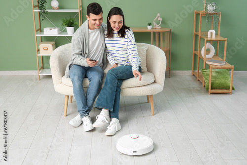 Young couple using mobile p...