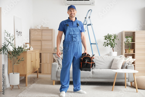 Male technician with bag of...