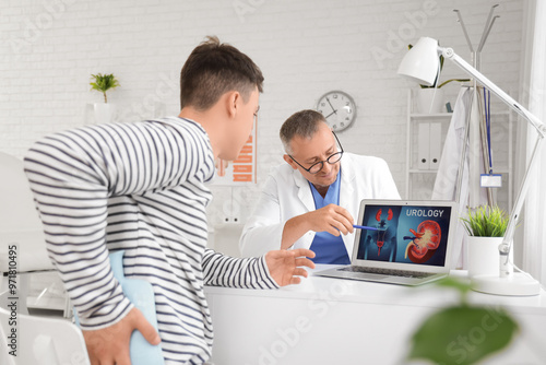 Mature doctor working with ...