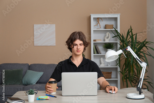 Male programmer sitting at ...