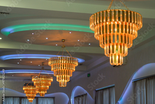 large led chandeliers on the ceiling of the large event hall