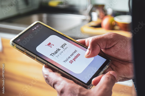 Customer loyalty program concept for marketing strategy. Man earned reward points by shopping online using mobile applications. 
